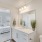 bathroom with large, lighted vanities