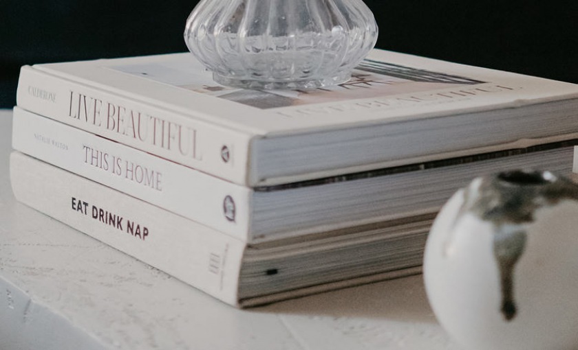 books and vases decorate coffee table